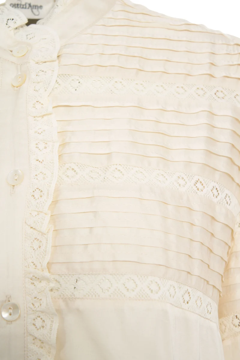 Blusa con dettagli con volant