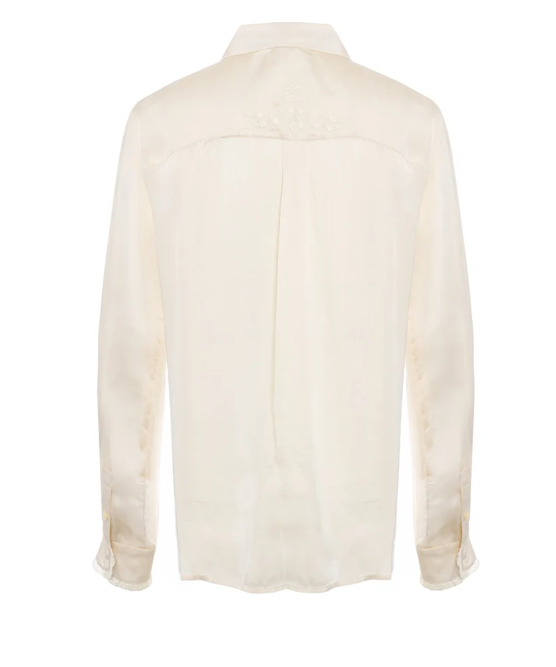 Blusa con ricami