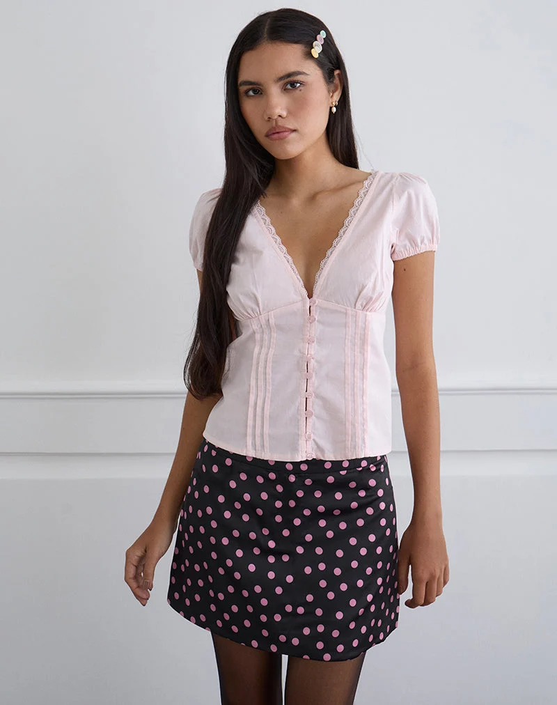 Maula Minirock aus schwarzem Satin mit rosa Polka-Punkten