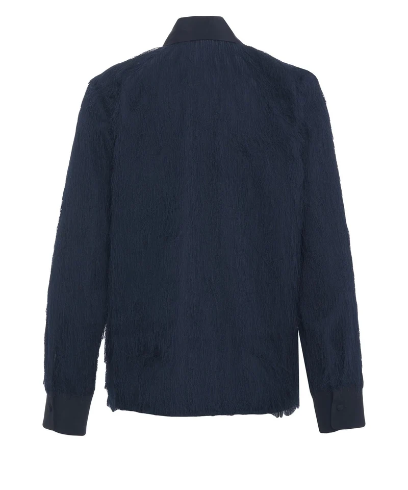 Blusa con dettagli di frange