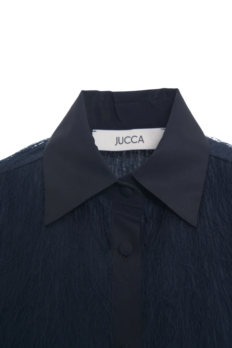 Blusa con dettagli di frange